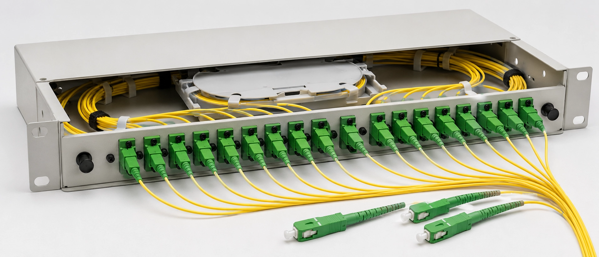 SC APC single-mode fiber optic pigtail cables arranged in a distribution panel showing ferrule connectors and yellow buffering SC APC single-mode fiber optic pigtail cables arranged in a distribution panel showing ferrule connectors and yellow buffering